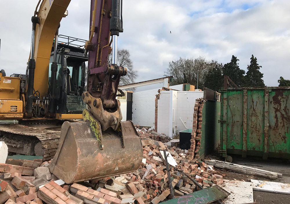 Site clearance using digger and excavator 